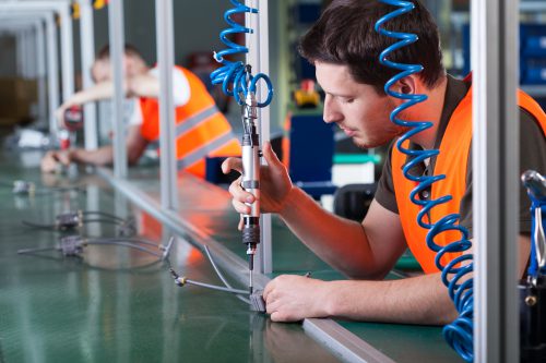 Men working on production line